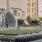a large building with a fountain in front of it