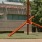 a red pole in front of a building